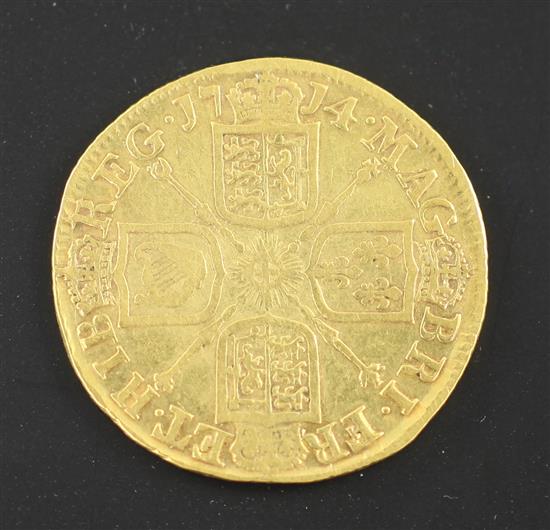 A Queen Anne gold guinea 1714, obv. scratch to bust otherwise F, rev. NVF